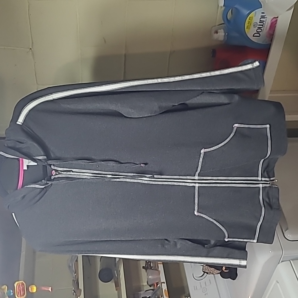 Avenue workout sweatshirt 65%polyester 35%rayon. White piping down the sleeves .